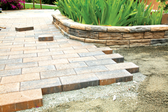 How to Decide Between a Deck or Pavers in an Outdoor Remodel